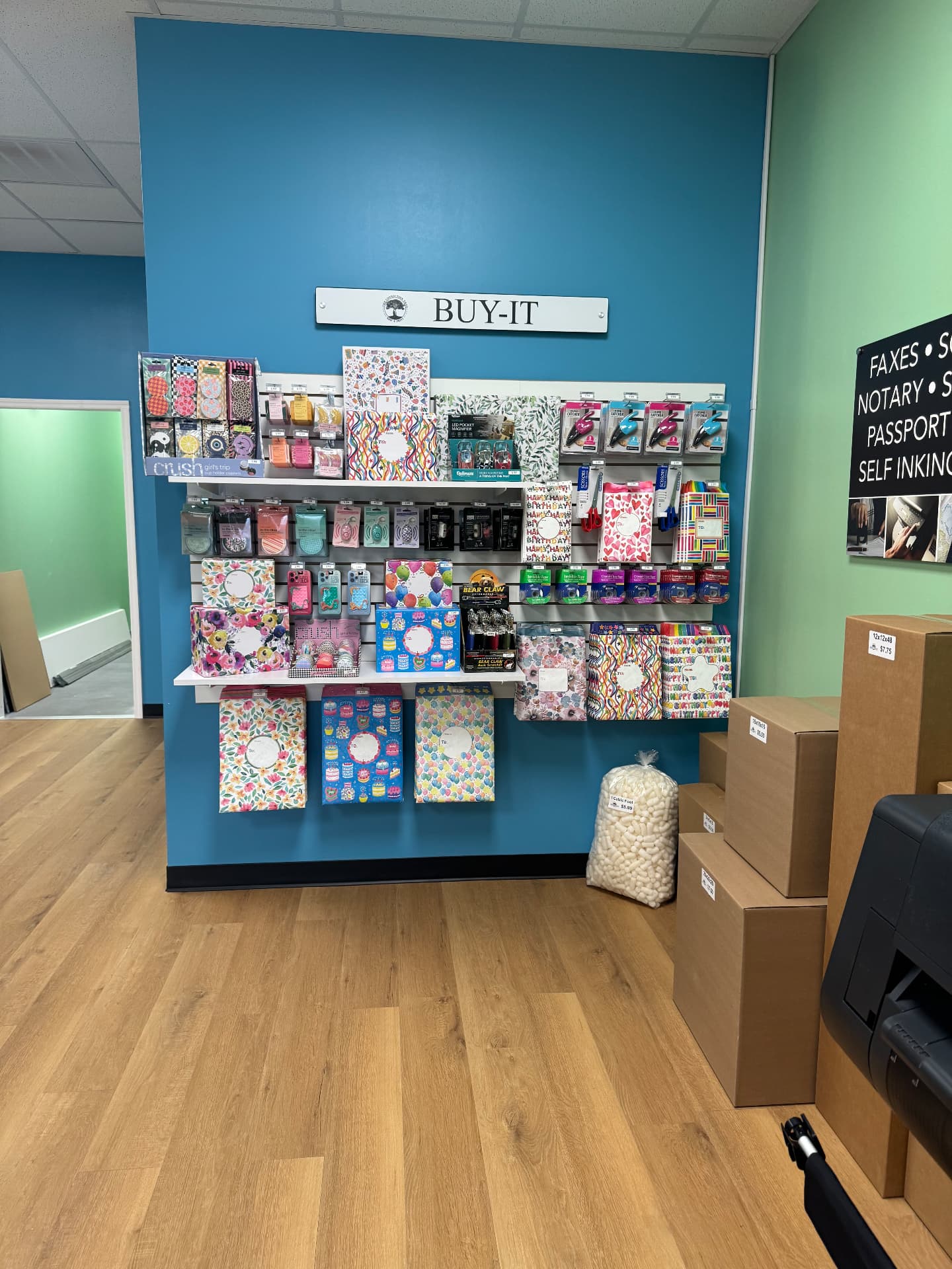 Buy-It wall with cards, gift wrap and office supplies
